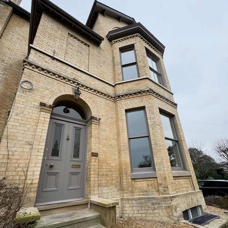 DOFF superheated steam cleaning and lime mortar repointing completed on buff yellow brickwork at Elcho Lodge in Bowdon WA14 2TL, a Grade II listed heritage property