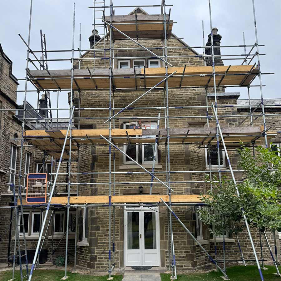Grade II listed Barclay Hall in Mobberley WA16 7DZ undergoing stone masonry restoration - DOFF cleaning and lime mortar repointing using NHL 3.5.