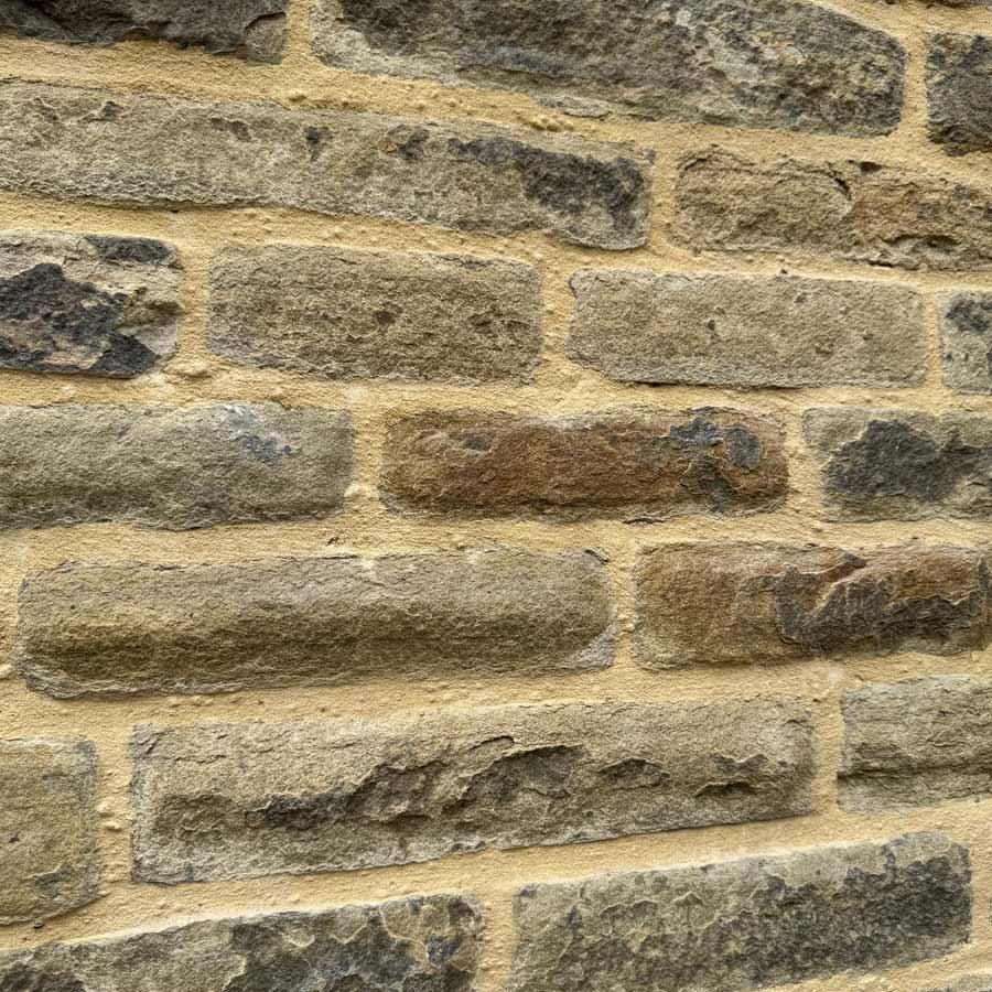 Close up view of Grade II listed Barclay Hall in Mobberley WA16 7DZ after stone masonry restoration - DOFF cleaning and lime mortar repointing using NHL 3.5.