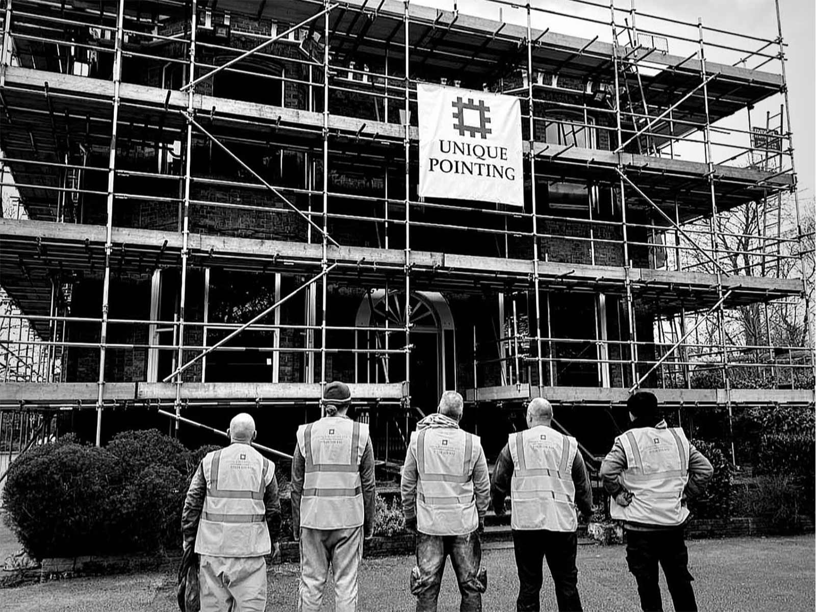 The team of stone masonry and brickwork restoration specialists at Unique Pointing surveying a project in Cheshire