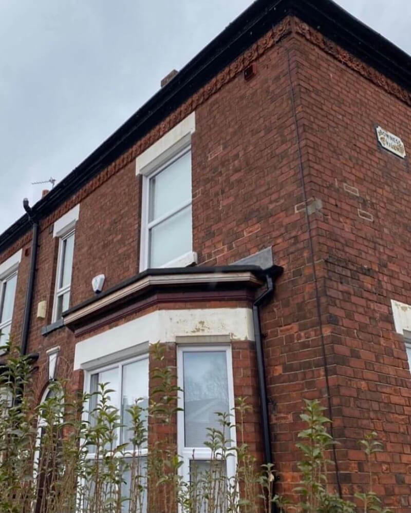 A Victorian terrace in Manchester before undergoing brick cleaning and repointing