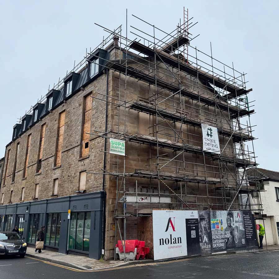 Specialist masonry restoration work - DOFF cleaning and lime mortar repointing - underway at the old Oddfellows Hall in Lancaster - a conservation property at LA1 1UR